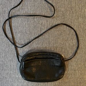 Baggu ‘mini’ black leather crossbody bag.